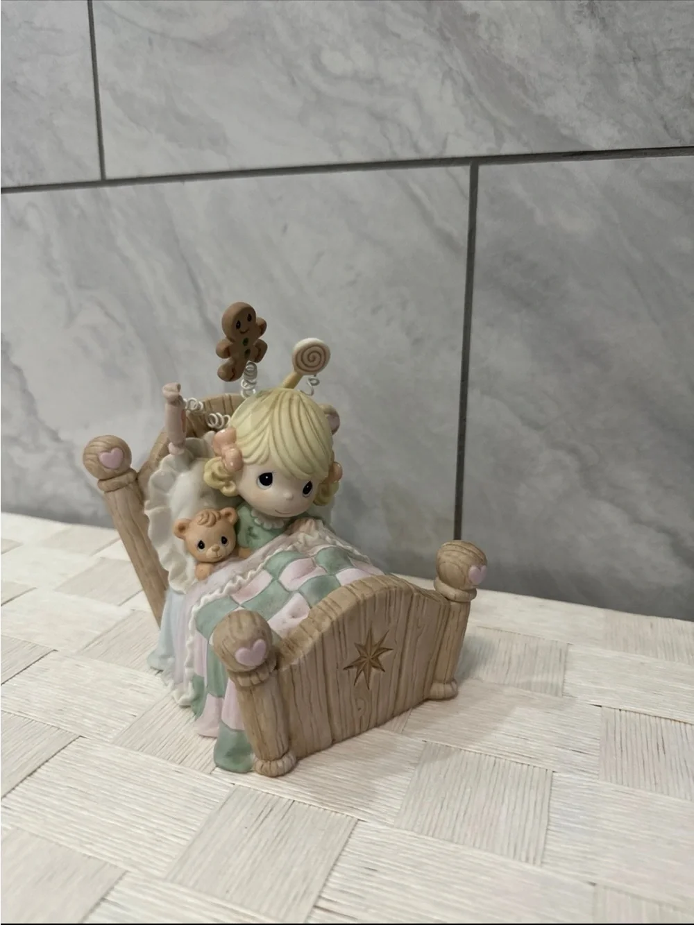Precious Moments Blonde Girl Figurine with Pastel Pink & Mint Quilt